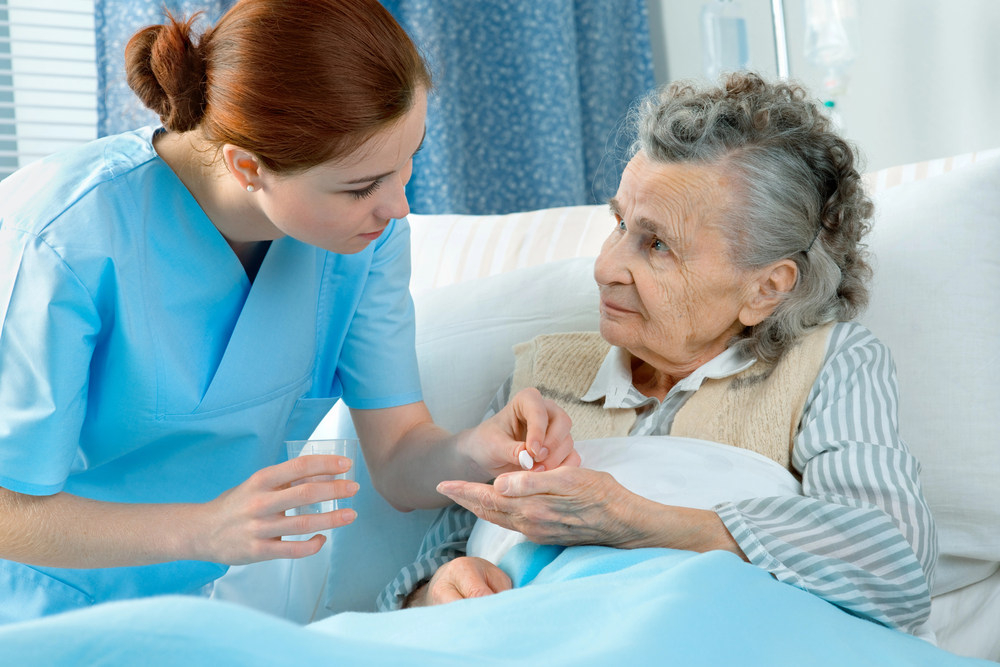 Caregiver Taking Care Of The Elderly