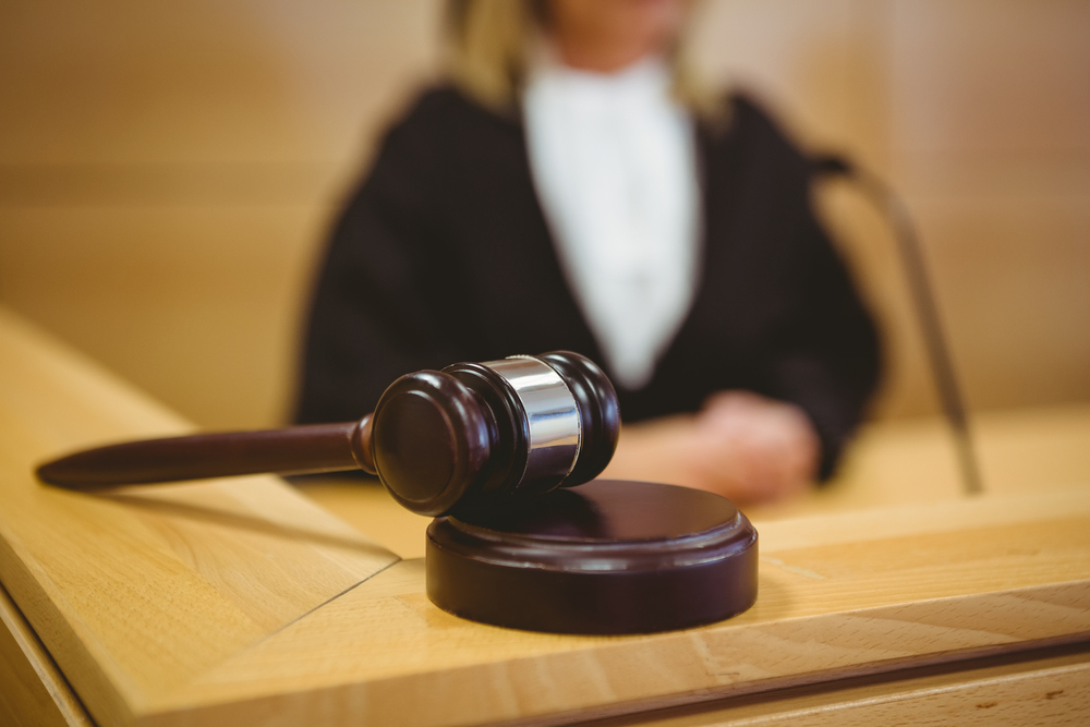 Gavel Resting On Sounding Block In The Court Room