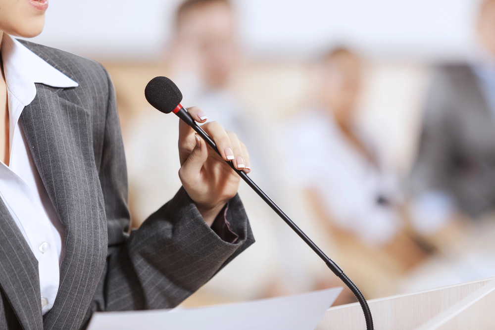 Politician Talking In Microphone